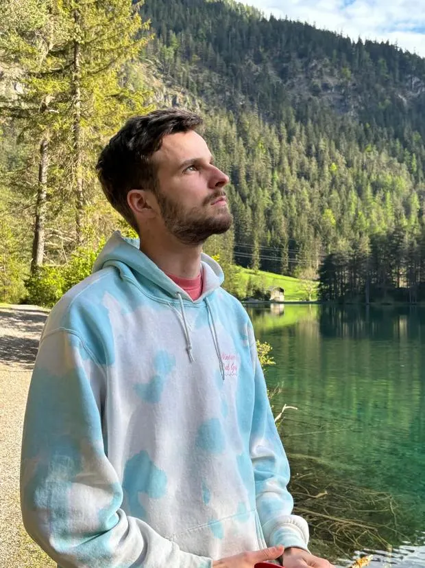 Portrait of Alain Pineault by a mountain lake